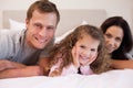 Family relaxing in the bedroom together Royalty Free Stock Photo