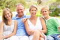 Family Relaxing In Garden