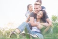 Family Relaxing In Garden . Young family with children having fun in nature Royalty Free Stock Photo