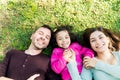 Family Relaxing On Grass Together At Park Royalty Free Stock Photo