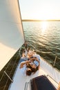 Family Relaxing Lying On Yacht Deck Looking At Sunset Outdoor Royalty Free Stock Photo