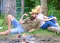 Family relaxing near bonfire after day of mushroom hunting. Family traditions. Family activity for summer vacation in Royalty Free Stock Photo