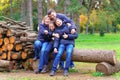 Family relaxing outdoor in autumn city park, happy people together, parents and children, they playing, talking and smiling, Royalty Free Stock Photo