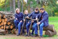 Family relaxing outdoor in autumn city park, happy people together, parents and children, they playing, talking and smiling, Royalty Free Stock Photo