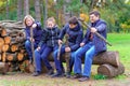 Family relaxing outdoor in autumn city park, happy people together, parents and children, they playing, talking and smiling, Royalty Free Stock Photo