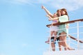 Family rests on yacht and indicates interesting Royalty Free Stock Photo