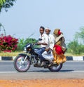 Family rides on a motorbike Royalty Free Stock Photo