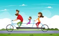 Family riding a bicycle in the park. Tandem bike. Royalty Free Stock Photo