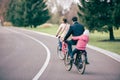 Family riding bicycles in park Royalty Free Stock Photo