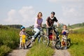 Family riding bicycles in summer Royalty Free Stock Photo
