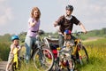 Family riding bicycles in summer Royalty Free Stock Photo