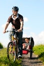 Family riding bicycles in summer Royalty Free Stock Photo