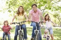 Family riding bikes Royalty Free Stock Photo