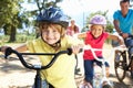 Family riding bikes having fun