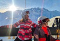 Family riding cabin cable car on winter vacation skiing