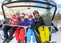 Family riding ski lift cable car on winter vacation skiing Royalty Free Stock Photo