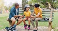 Family, rollerskate and interracial parents help kid with safety pads teaching her skating at the park and bonding