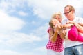 Family romping on field