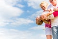 Family romping on field