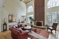 Family room with two story brick fireplace Royalty Free Stock Photo