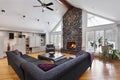 Family room with two story stone fireplace Royalty Free Stock Photo