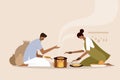 An Indian family making and eating `Roti` in the traditional way