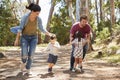 Family Running Along Path Through Forest Together Royalty Free Stock Photo