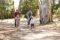 Family Running Along Path Through Forest Together Royalty Free Stock Photo
