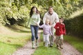 Family running along woodland track Royalty Free Stock Photo