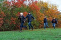 Family running in autumn city park, happy people together, parents and children, beautiful nature with colorful leaves Royalty Free Stock Photo