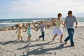 Family Running on the Beach Royalty Free Stock Photo