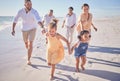 Family, running and beach vacation for children, parents and grandparents enjoying energy and summer travel on fun Royalty Free Stock Photo