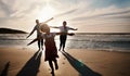 Family, running and freedom on beach with sunset, shadow and fun together, games and bonding on vacation. Travel Royalty Free Stock Photo