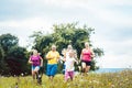 Family running on a meadow for sport Royalty Free Stock Photo