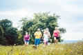 Family running on a meadow for sport Royalty Free Stock Photo