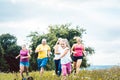 Family running on a meadow for sport Royalty Free Stock Photo