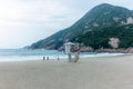 Family running and playing on the beach of the village of Shek O near Hong Kong early in the morning - 2 Royalty Free Stock Photo