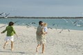 Family running to beach