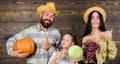 Family rustic style farmers market with fall harvest. Harvest festival concept. Parents and daughter celebrate harvest Royalty Free Stock Photo