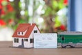 Family`s little house, green leather train and a train ticket home Royalty Free Stock Photo