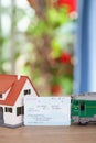 Family`s little house, green leather train and a train ticket home Royalty Free Stock Photo