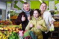 family satisfied with shopping in greengrocery