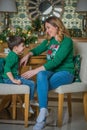 Family scene mom  and kid , Christmas time Royalty Free Stock Photo