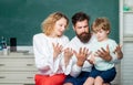 Family school. Woman and man helps the child boy Counting on fingers. Supporting pupils at school. Nice family photo of Royalty Free Stock Photo