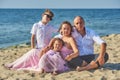 Happy married couple with children on their wedding anniversary day in their wedding dresses . Royalty Free Stock Photo