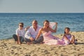 Happy married couple with children on their wedding anniversary day in their wedding dresses . Royalty Free Stock Photo