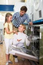 Family selecting dishwasher in store Royalty Free Stock Photo