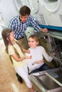 Family selecting dishwasher in store Royalty Free Stock Photo