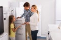 Family selecting refrigerator