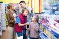 Family selecting tooth-brushes Royalty Free Stock Photo